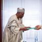 President Muhammadu Buhari receives the report of the Presidential Review Panel on National Intelligence Agency (NIA) from former Minister of Foreign Affairs, Ambassador Babagana Kingibe at the Presidential Villa on Tuesday, December 19, 2017
