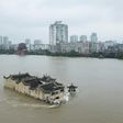 The Guanyinge temple, a 700-year old structure built on a rock in the Yangtze River in Wuhan, is surrounded by flood water