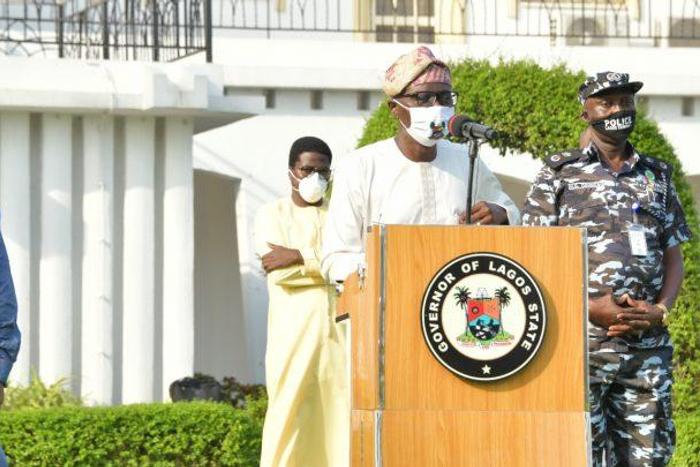 Lagos State Governor, Mr Babajide Sanwo-Olu (middle), addressing the media; Deputy Governor, Dr Obafemi Hamzat (left); Commissioner of Police, Lagos Command, Mr Hakeem Odumosu (right) and Head of Service, Mr Hakeem Muri-Okunola (behind) during a media ...