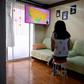 High school student Vanessa Villegas takes a class in front of her television at her house in Mexico City on August 24, 2020