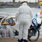 Medical workers transfer a passenger with COVID-19 from the Greg Mortimer cruise liner to an ambulance at Montevideo's port on April 8, 2020