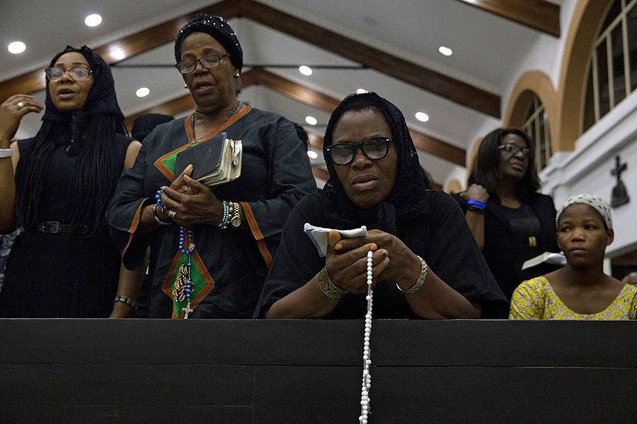Christians observing their worship in a church building. [Credit - Christian Science Monitor]