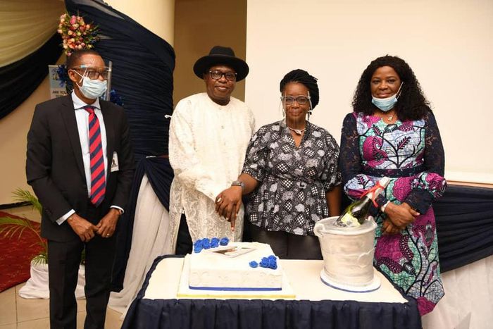 L-R: Director, Public Affairs, Nigerian Communications Commission (NCC), Dr. Ikechukwu Adinde; former Head, Media and Public Relations, NCC/celebrant, Mr. Sonny Aragba-Akpore; his wife, Florence and Director, Projects, NCC, Mrs. Abigail Solanke, during...