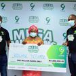 Taiwo Embassey, Head Regional Sales 9mobile; Arise Oluwaseun Omobolanle, Smart Phone winner and Ehimare Omoike, Acting Director Customer Care 9mobile presenting the phone at the 9mobile National Mega Millions Promo Lagos presentation recently