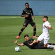 Adrien Perez Los Angeles FC reacts as he loses his footing in front of Sebastian Lletget, who was one of the scorers in the LA Galaxy's 2-0 Major League Soccer win over their cross-town rivals