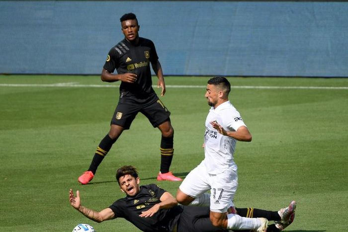 Adrien Perez Los Angeles FC reacts as he loses his footing in front of Sebastian Lletget, who was one of the scorers in the LA Galaxy's 2-0 Major League Soccer win over their cross-town rivals