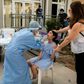 A Cypriot schoolgirl undergoes a swab test for the coronavirus on her first day back at school in the capital Nicosia after the lifting of a two-month lockdown