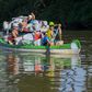 Rafters race down the Tisza River in northeastern Hungary collecting as much rubbish as possible