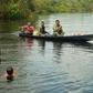 Fishermen and children are seen in the river in Bauana, a village in the heart of the Brazilian Amazon, on March 14