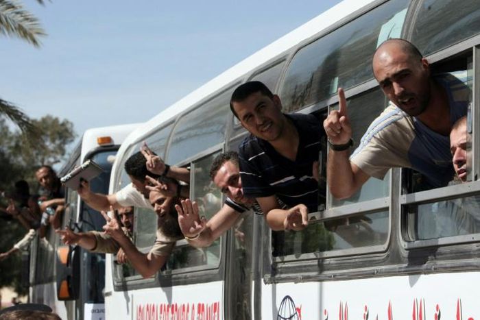 Palestinian prisoners cross into the Gaza Strip following their release from Israeli jails in the last exchange between the two sides in October 2011