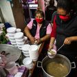 Lidia Portales, center, is helping feed sex workers deprived of their livelihoods by Peru's lockdown imposed over the coronavirus pandemic