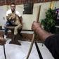 Egyptian lion tamer Ahsraf el-Helw poses with his lioness Joumana at his home in Cairo