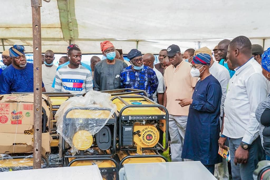 Gov. Oyetola with some of his cabinet members inspecting the stolen items returned by hoodlums.  [Twitter/@GboyegaOyetola]