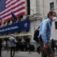 The New York Stock Exchange, the symbolic heart of Wall Street, reopened its floor after a two-month closure due to the coronavirus, with traders donning masks and separated by plexiglas