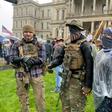 Armed demonstrators protest stay-at-home orders in Lansing, Michigan on May 14, 2020