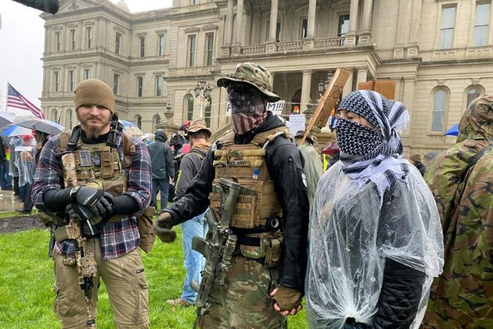 Armed demonstrators protest stay-at-home orders in Lansing, Michigan on May 14, 2020