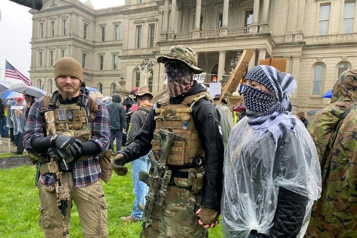 Armed demonstrators protest stay-at-home orders in Lansing, Michigan on May 14, 2020