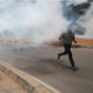 Kenyan police enforcing lock-down take to their heels as residents chase them up with teargas