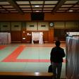 A judo hall in Yokohama has been repurposed as a shelter for homeless people whose usual net cafe refuges have been closed due to the coronavirus pandemic