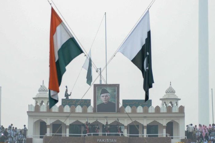 The Indian and Pakistan flags fly during the daily beating of the retreat ceremony at the Wagah Border