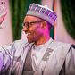 President Muhammdu Buhari congratulates Dapo Olorunyomi (Pulse)