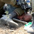 Israeli soldiers detain a Palestinian protester on September 1, 2020