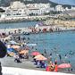 Algerians throng a beach in the Bab el-Oued suburb of the capital Algiers after authorities reopened beaches for the first time following a five-month coronavirus lockdown