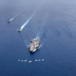 Aircraft carriers the USS Nimitz and USS Ronald Reagan sailing in Asia in July -- Washington is pushing back against Beijing over its military buildup in the South China Sea