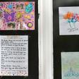 Messages of support for the residents are displayed in the windows of a care home in Stockport, Greater Manchester