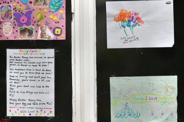 Messages of support for the residents are displayed in the windows of a care home in Stockport, Greater Manchester