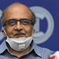 Prashant Bhushan smiles during a press conference in New Delhi after being fined a token one rupee (one US cent) for contempt of court