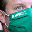 The Werder Bremen squad, under head coach Florian Kohfeldt seen here wearing a face mask bearing the logo "team spirit", has also agreed to another pay-cut