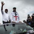 In happier times: Tshisekedi, right, and Vital Kamerhe, wave to supporters at an election campaign rally in Kinshasa in November 2018