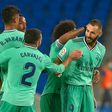 Karim Benzema (R) celebrates with his Real Madrid teammates after scoring in Sunday's 2-1 win at Real Sociedad which put them back in command in the Spanish title race