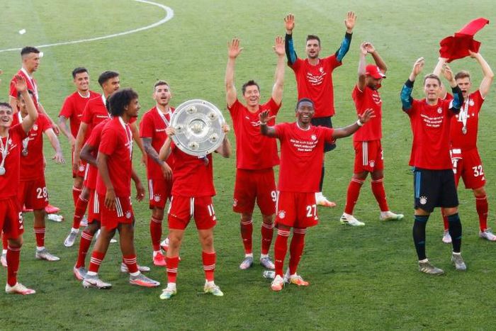 Bayern Munich players celebrate with the Bundesliga trophy on Saturday