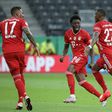 Bayern Munich star Jerome Boateng (L) praised the 'world-class' display of Canadian team-mate Alphonso Davies (C) in the Champions League rout of Barcelona