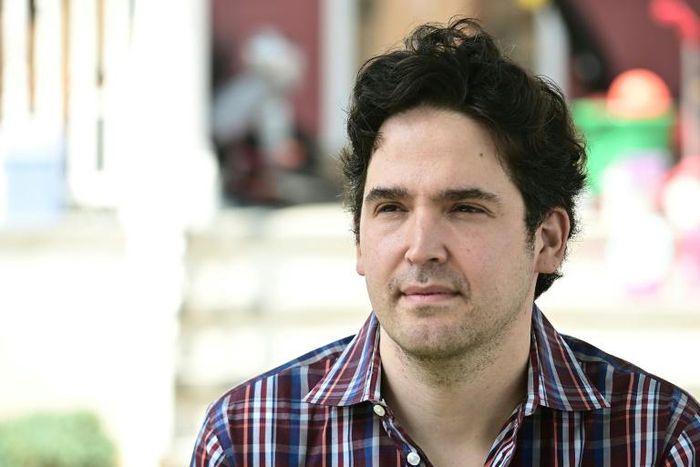 Scott Krakower, a psychiatrist poses in front of his home in Port Washington on Long Island, New York