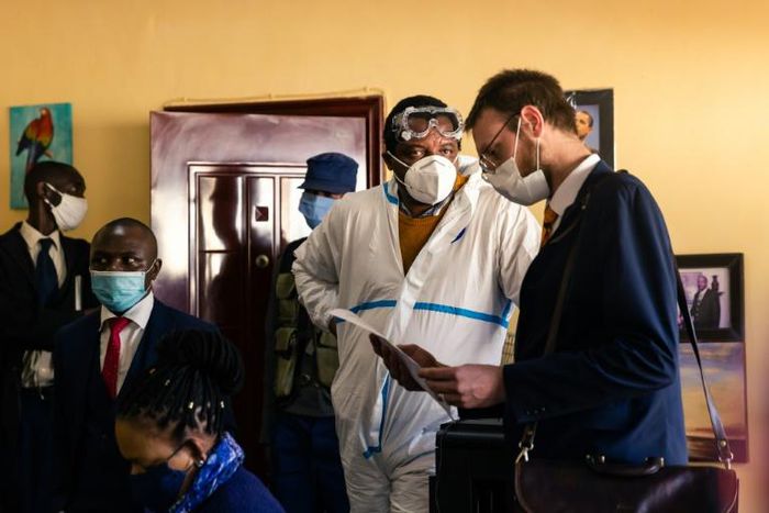 Zimbabwean journalist Hopewell Chin'ono, centre, was arrested on July 20