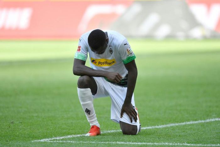 Moenchengladbach forward Marcus Thuram takes a knee after scoring in Sunday's 4-1 win at home to Union Berlin.