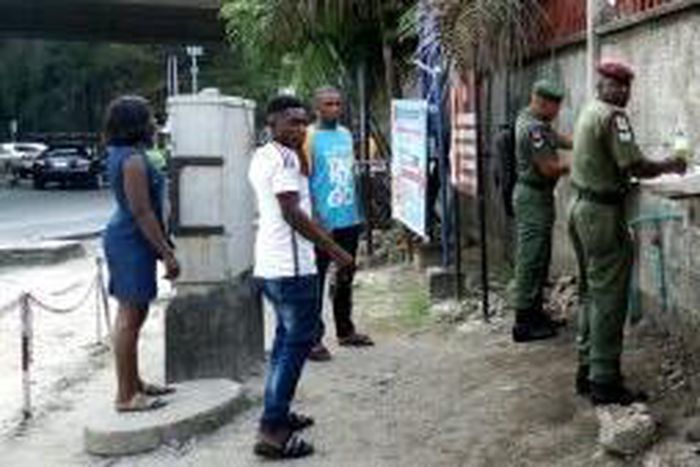 Hand washing and sanitising at the entrance of Bonny Army Cantonment in Lagos. [NAN]