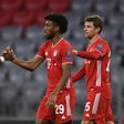 Kingsley Coman (C) celebrates scoring the opening goal in Bayern Munich's 2-0 win over Atletico Madrid