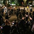 Demonstrators confront law enforcement during a protest against racial injustice, police brutality and the deployment of federal troops to US cities on July 29, 2020 in Portland, Oregon
