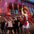 Liverpool fans celebrate winning the Premier League outside Anfield