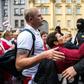 Protesters speak with Belarusian special police officers at a rally against disputed presidential elections results in Minsk on August 30, 2020