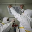 Medical staff seal a vent in what used to be an isolation ward for patients infected by the COVID-19 coronavirus at a hospital in Wuhan, China