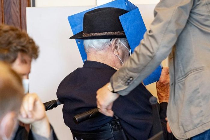 Dey hides his face as he arrives for a hearing earlier this week