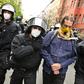Police remove a demonstrator during he anti-confinement protest in Berlin