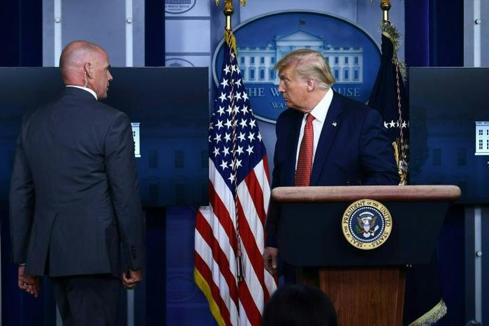 US President Donald Trump was abruptly ushered out of a press conference by secret service agents, and later said that a person had been shot outside the White House