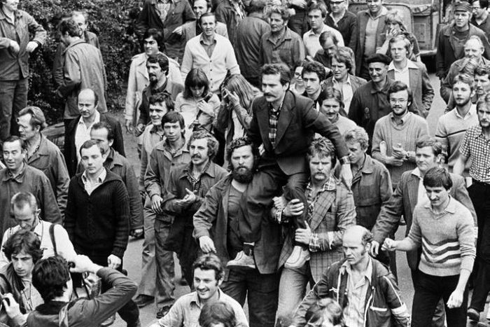 Lech Walesa was carried on fellow dockworkers' shoulders after signing a 1980 pact with Poland's Communist leadership