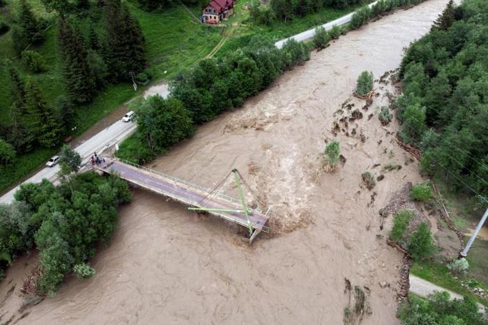 A collapsed bridge in western Ukraine after heavy flooding